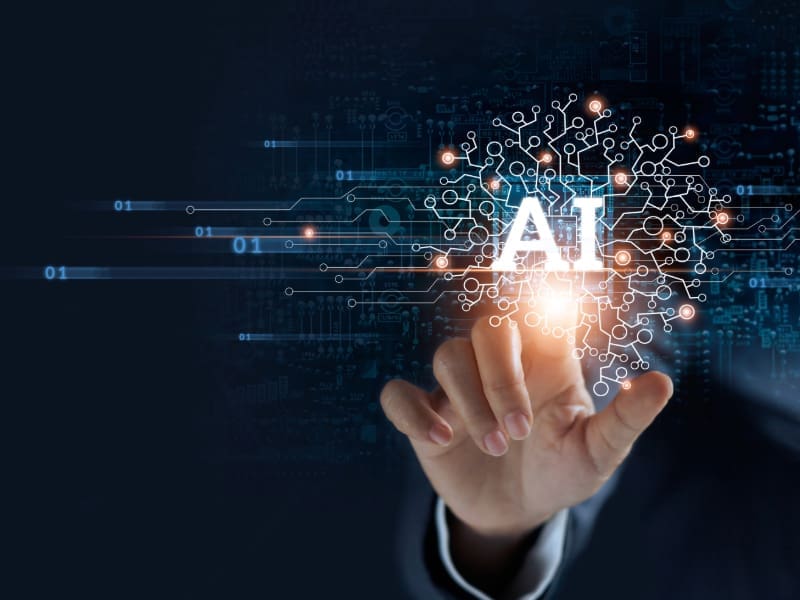 A businessman analyzing data on a futuristic screen, representing the reality vs. hype of AI. My Tampa IT helps businesses navigate AI advancements.